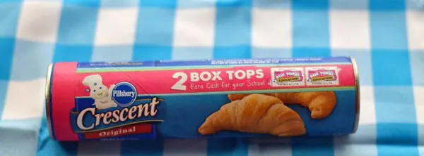 A can of original pillsbury crescent rolls on a blue and white checkered background