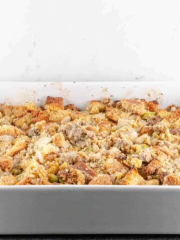 Cornbread and Sausage Dressing Recipe baked in a white casserole dish and ready to serve