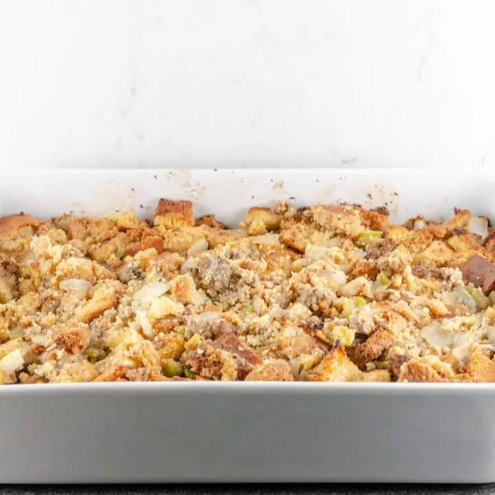 Cornbread and Sausage Dressing Recipe baked in a white casserole dish and ready to serve