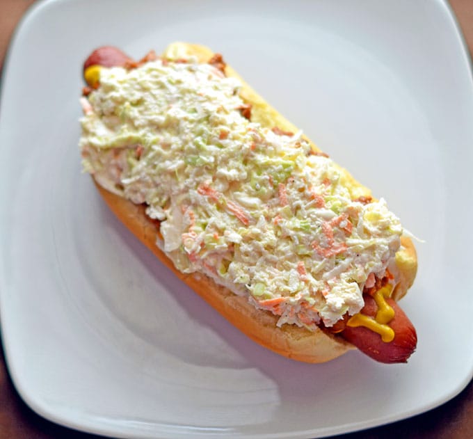 Southern hot dog slaw piled high on a hot dog in a bun