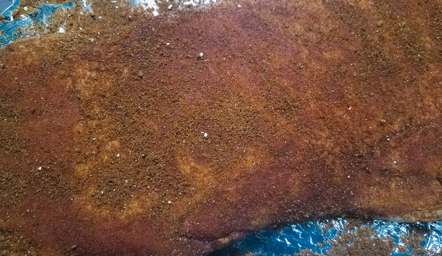 The Best Dry Rub Recipe for Pork Photo on rack of baby back ribs