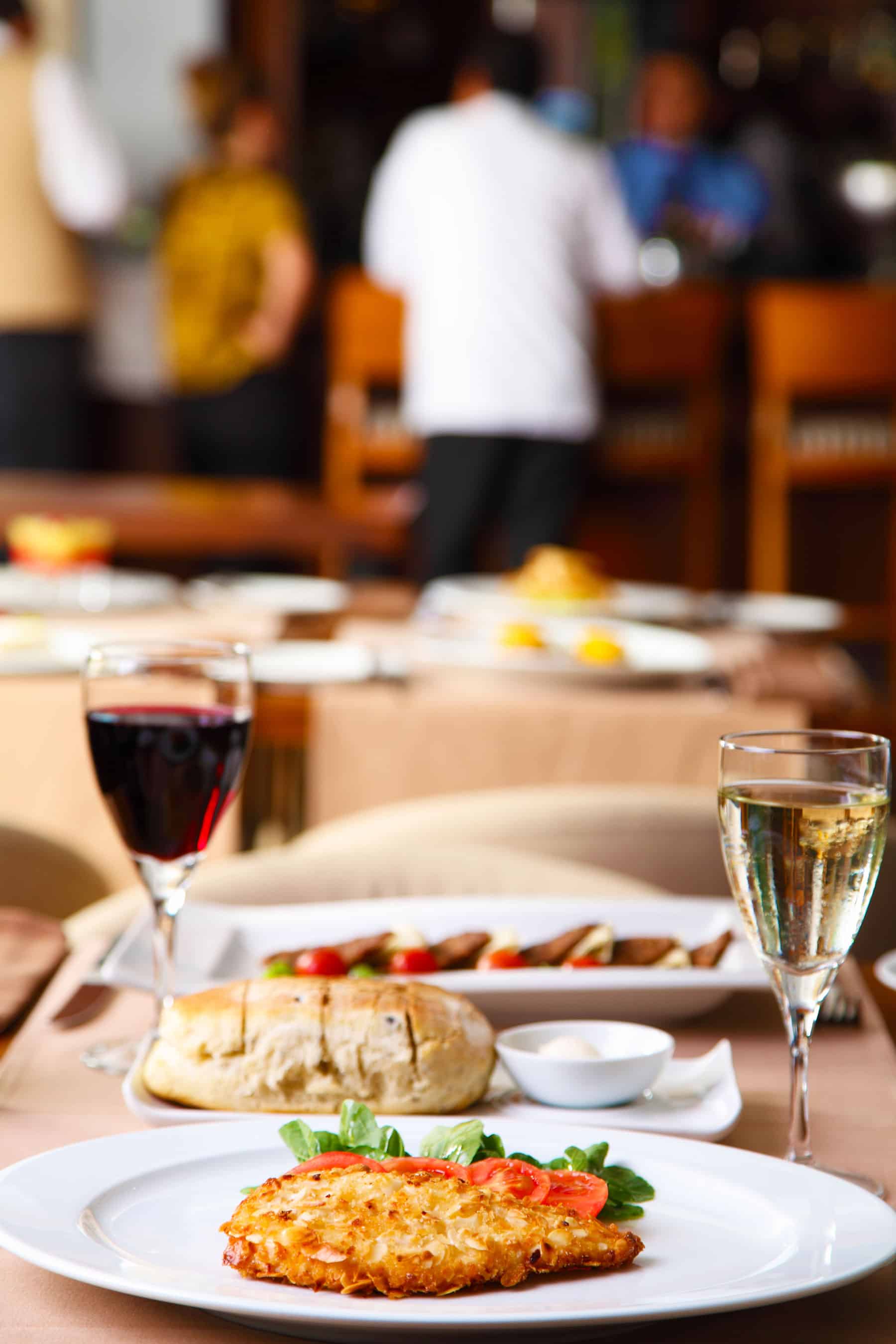 Tips For How to Save Money On Eating Out - Restaurant Photo with food and wine