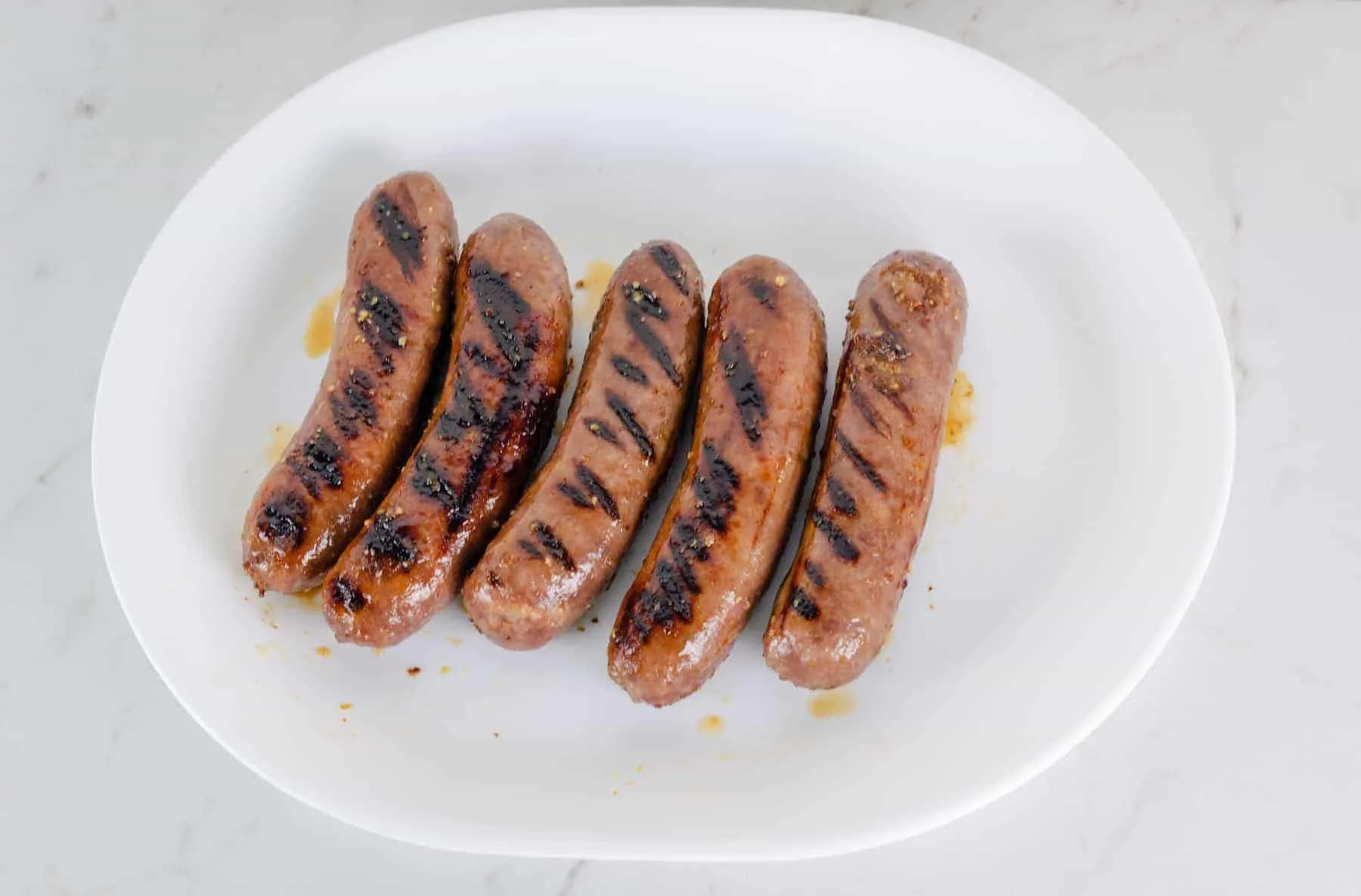 Honey Mustard Beer Glazed Bratwurst Recipe Picture - grilled bratwurst on a platter