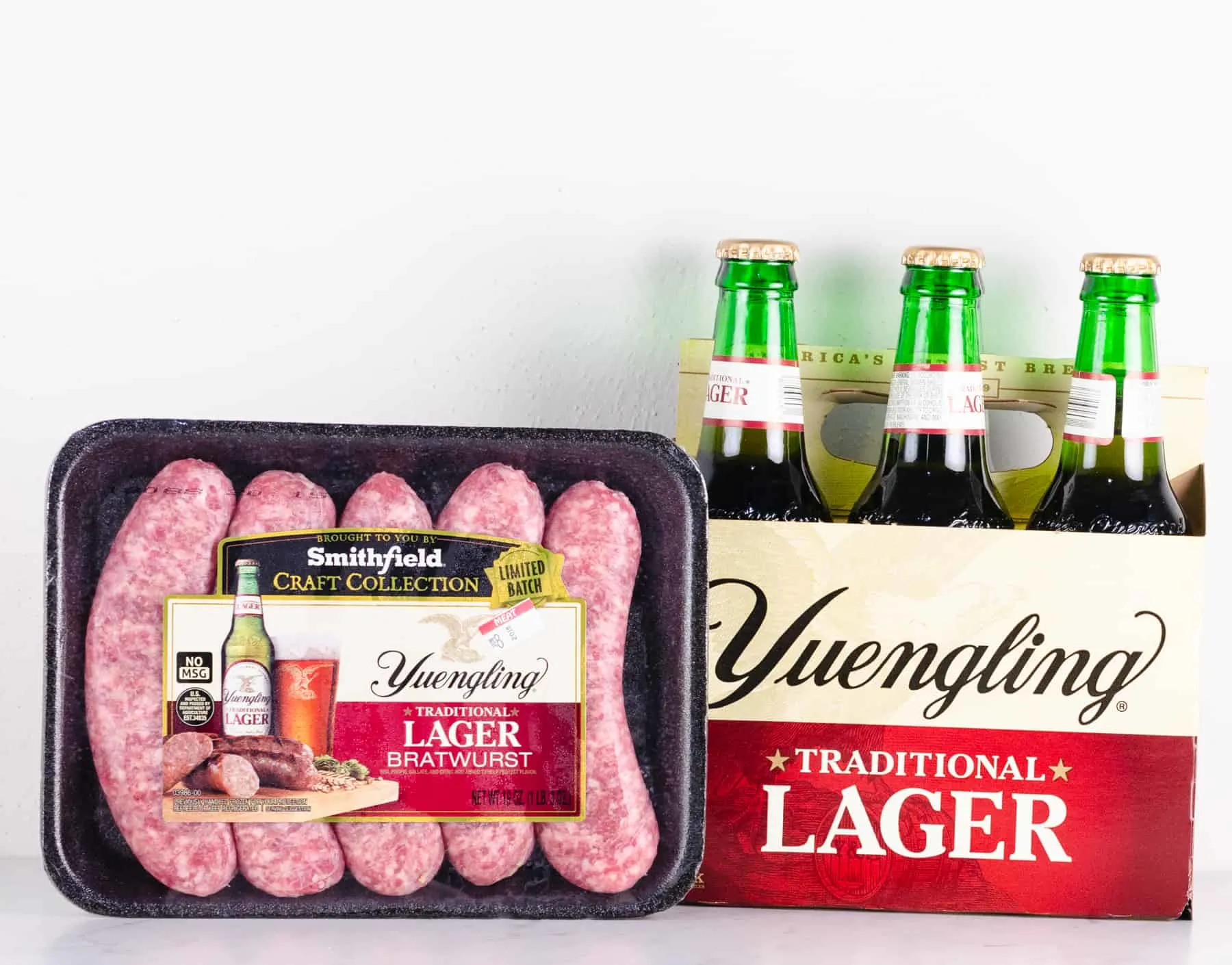 Raw Yuengling Lager Bratwurst with a 6-pack of Yuengling traditional lager
