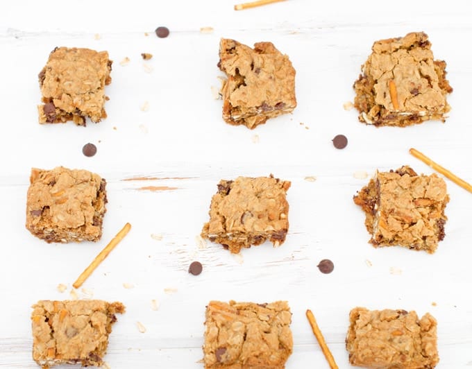 oatmeal chocolate chip pretzel bars cut up ready to eat on wood table