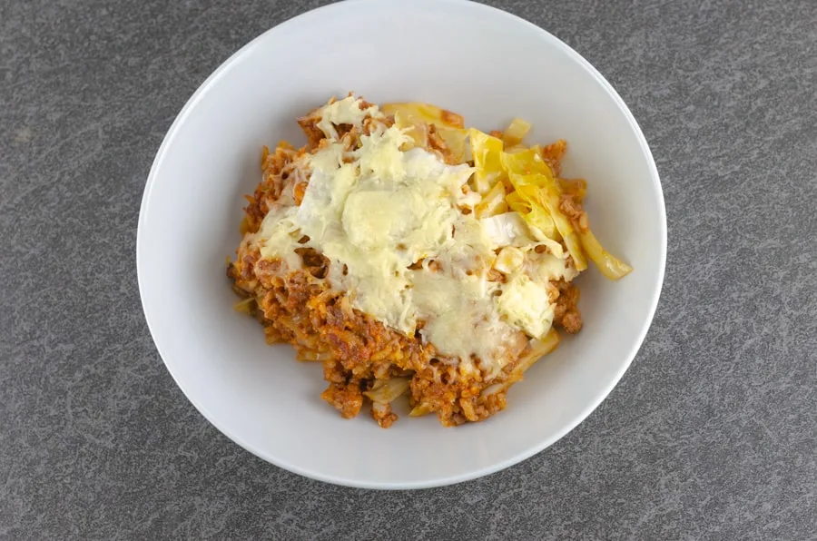 overhead shot of Creamy Unstuffed Cabbage Roll Casserole Recipe plated in a white bowl