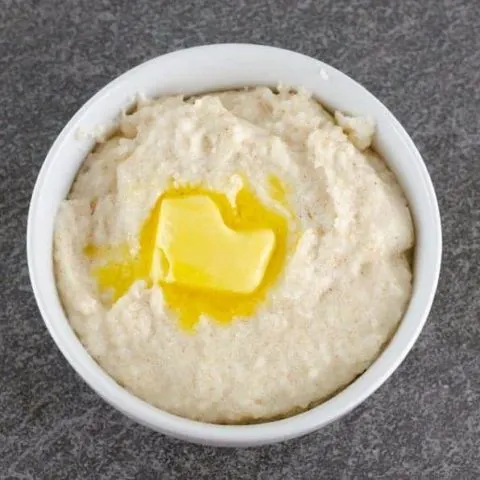 Bowl of homemade cream of wheat topped with a pat of butter