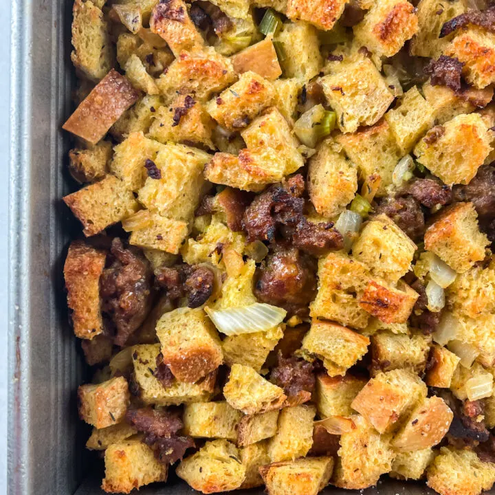 bottom left corner of a pan of sausage and sourdough stuffing.
