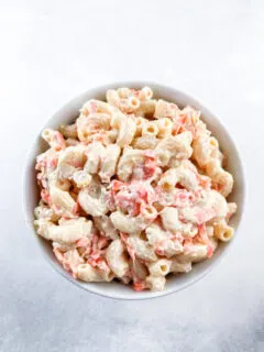Prepared Hawaiian macaroni salad in a white round bowl.