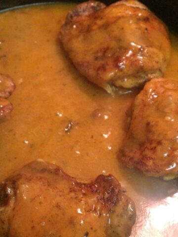 Chicken thighs prepared with Campbell's Chicken Marsala sauce in a skillet