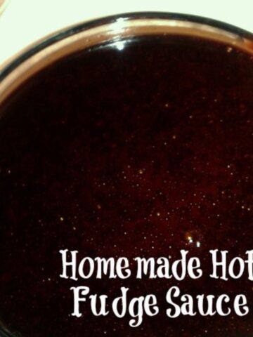 A round glass bowl full of homemade hot fudge sauce