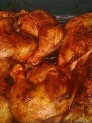 oven baked bbq chicken in a roasting pan