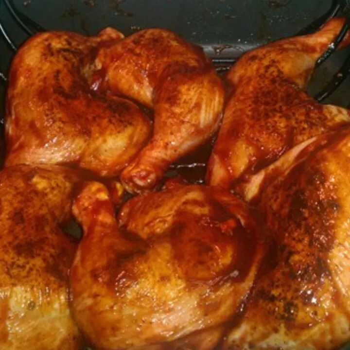 oven baked bbq chicken in a roasting pan