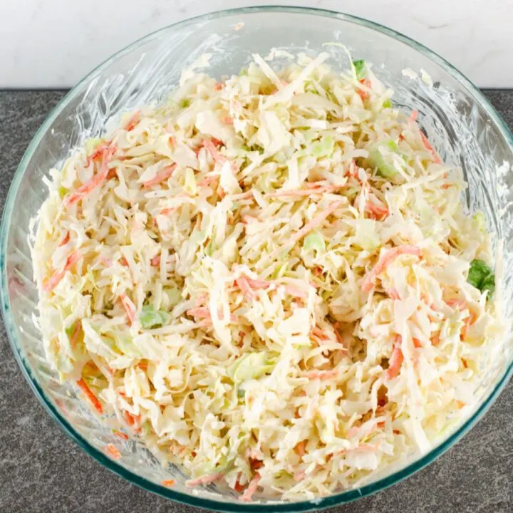 Prepared southern hot dog slaw recipe in a large glass mixing bowl