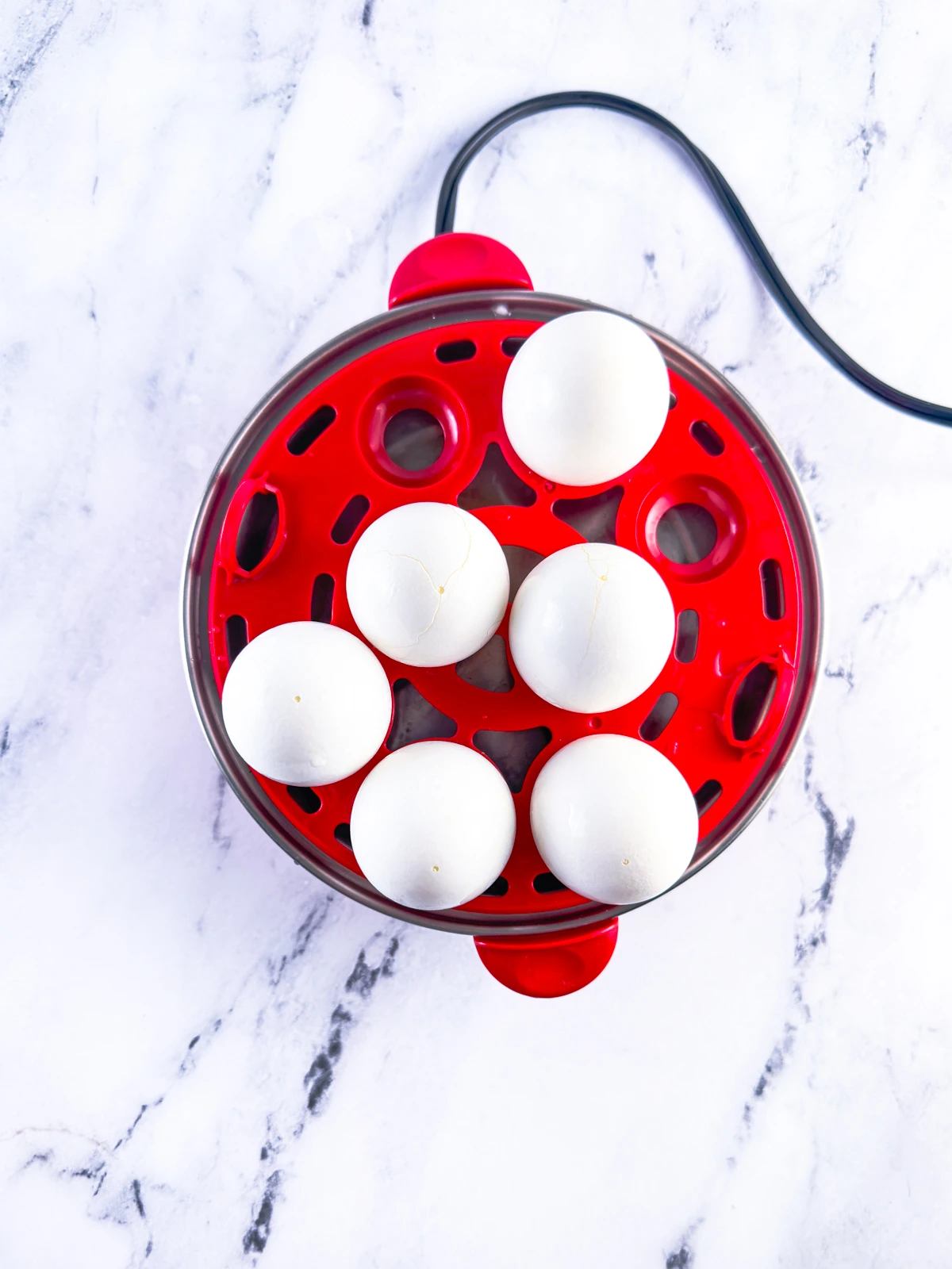 Hard boiled eggs in an electric egg cooker.