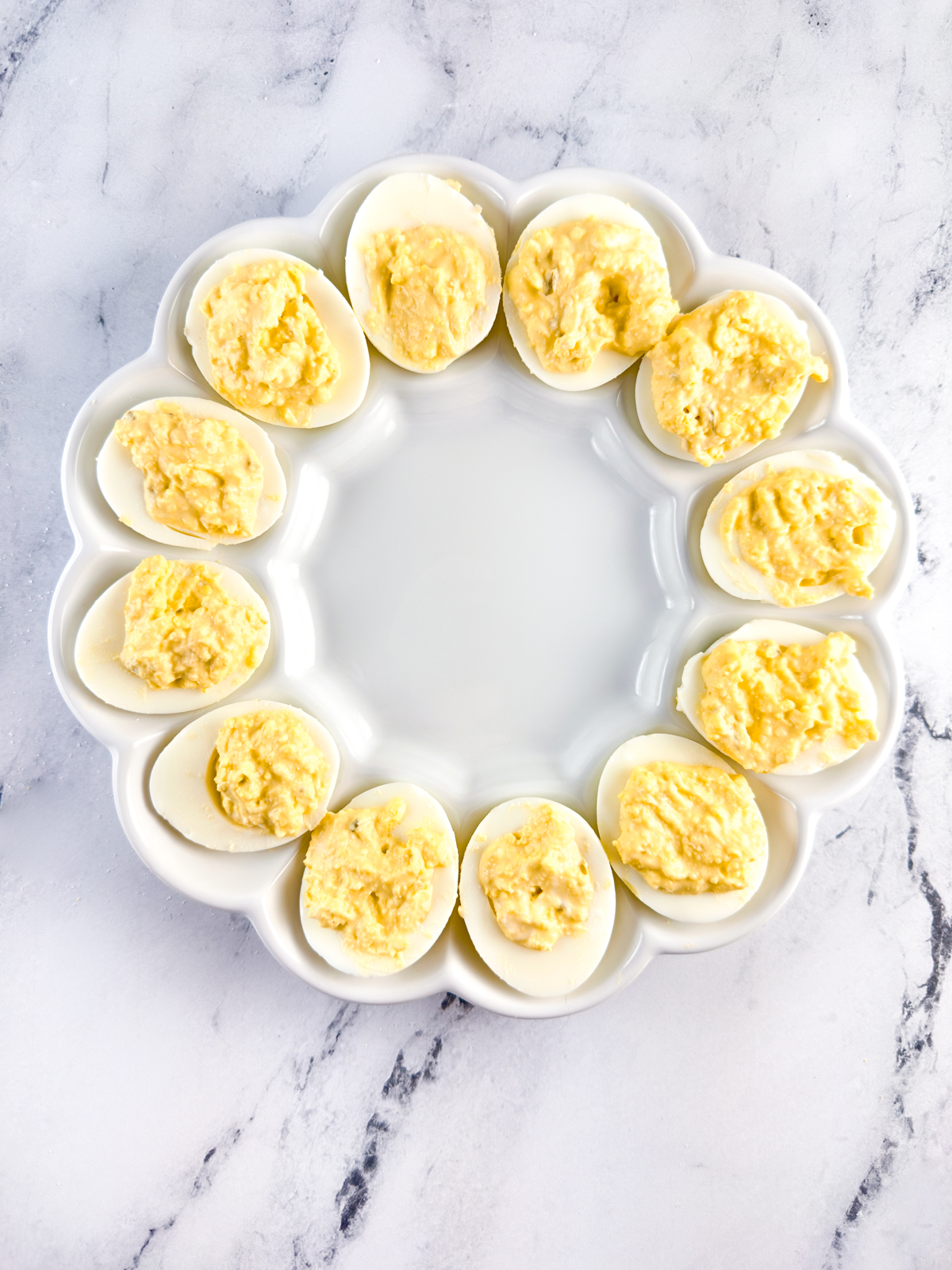 Filled Southern deviled eggs on a deviled egg platter.