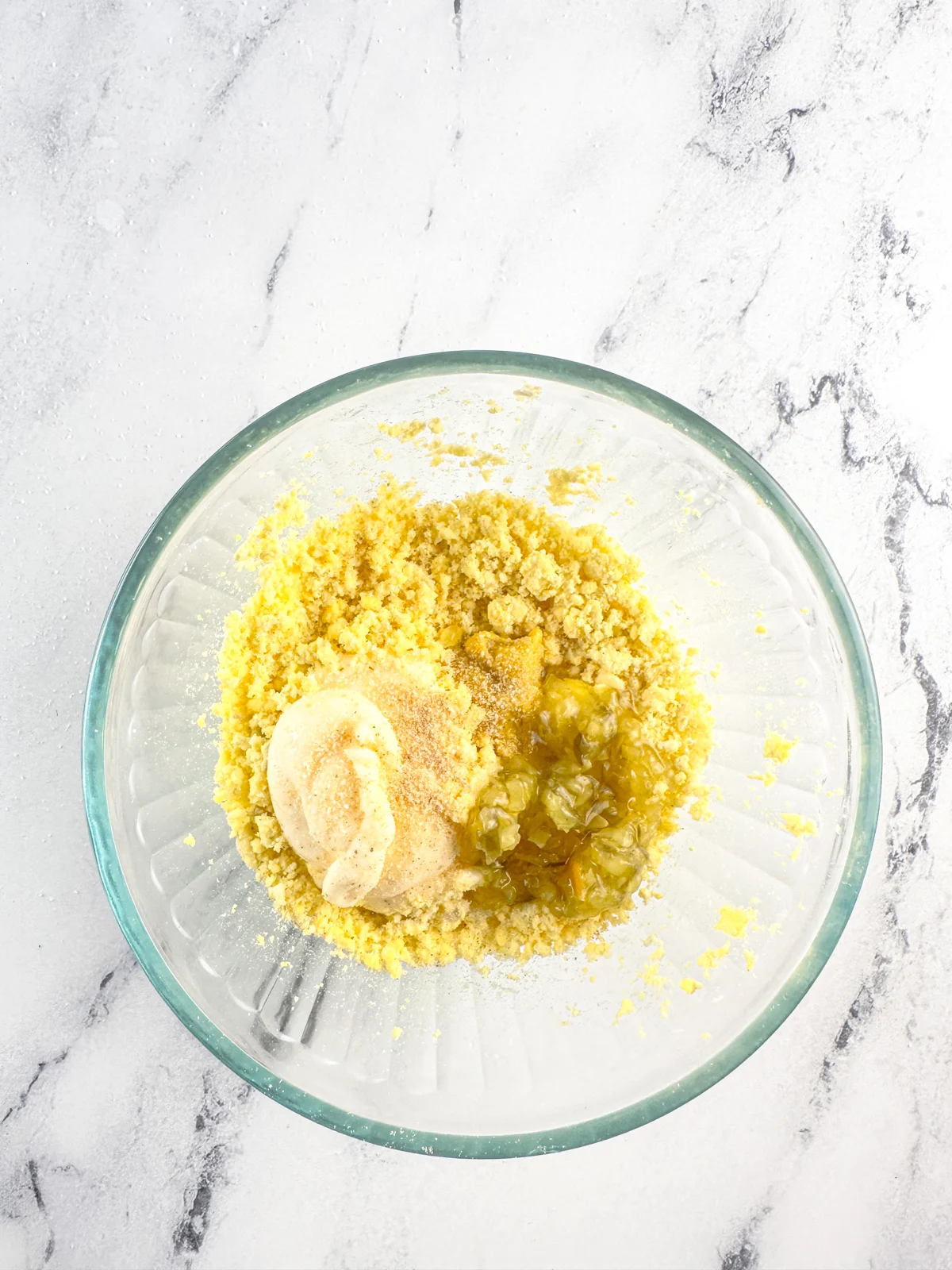 Ingredients for Southern deviled eggs filling in a glass bowl.