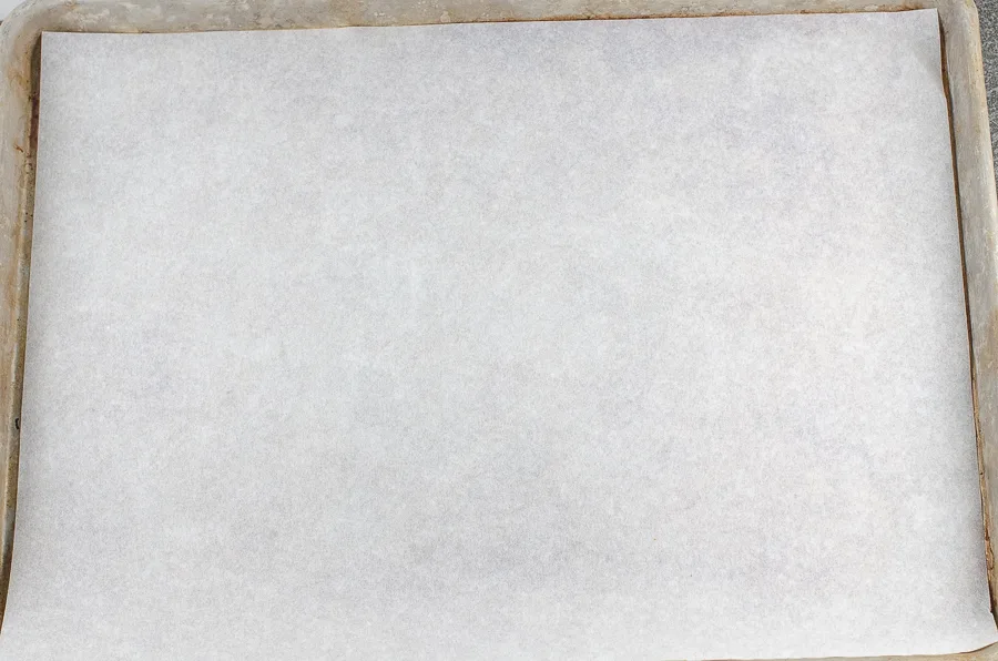 A half sheet lined with a sheet of parchment paper.